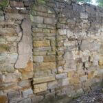 This blocked up alcove is where there was a carved figure. 
This was removed in the early 50's and taken up to the old vicarage in Heath village. It later went to the Diocese at Derby Church blocked up alcove